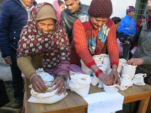 Farmers display collected  rare varieties of local beans, soybean and other crop seeds, at Seed Handover Event, Nepal. Credit: Bioversity International/D. Gauchan