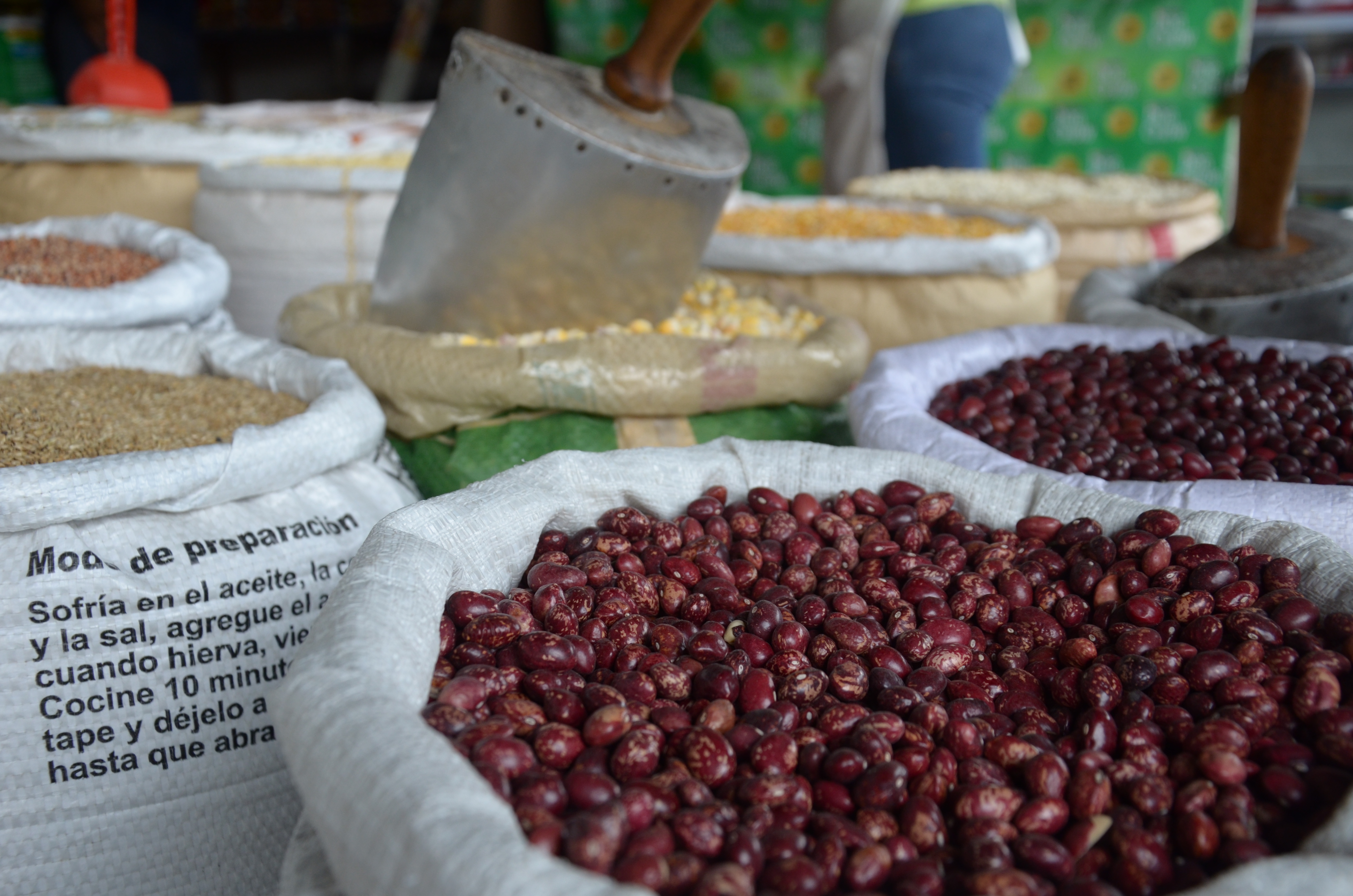 Beans - an important staple food in Colombia - and other products for sales in Alameda Market, Cali, Colombia. Photo by: Melissa Reichwage/CIAT. Beans - an important staple food in Colombia - and other products for sales in Alameda Market, Cali, Colombia. Photo by: Melissa Reichwage/CIAT.